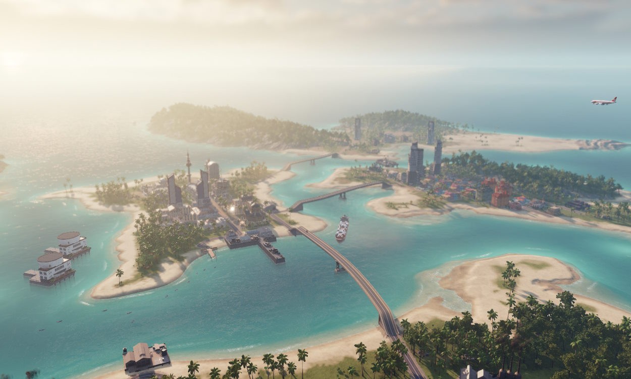 Ảnh chụp màn hình Tropico 6 trên Xbox, cho thấy một hòn đảo nhiệt đới với các công trình kiến trúc và cơ sở hạ tầng đa dạng.