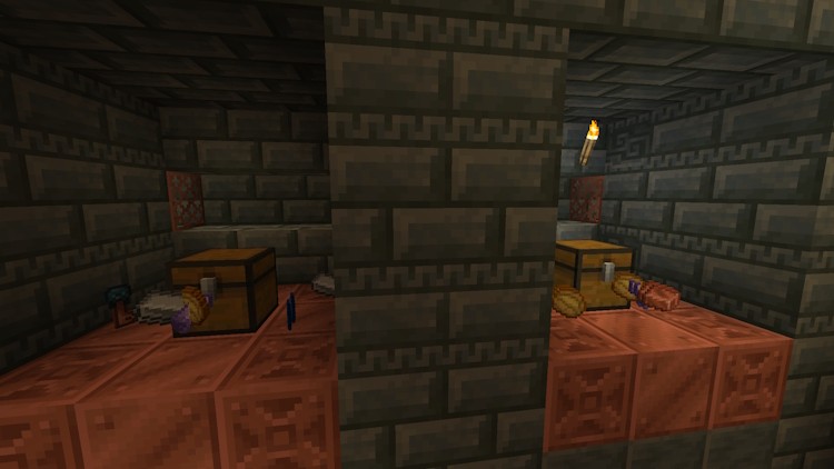Hai rương loot và một số vật phẩm loot có thể có bên cạnh chúng trong Minecraft snapshot 23w45a.